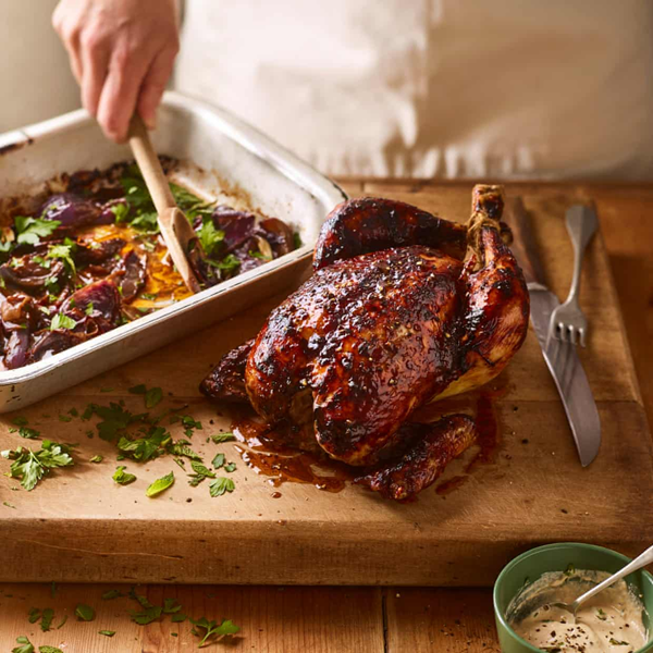 Pomegranate chicken, roasted onions, tahini (Sam Lone)