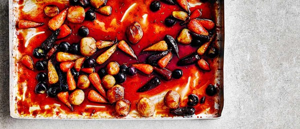Pomegranate-glazed baby vegetables with grapes