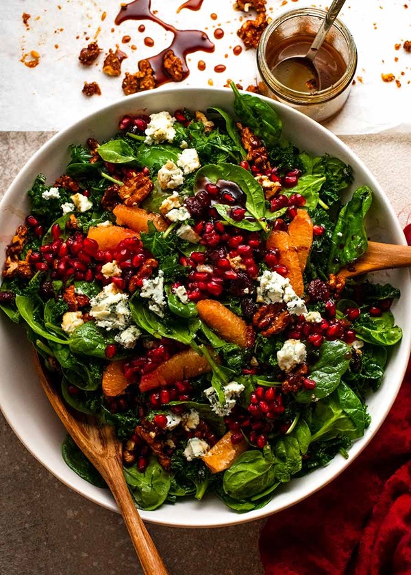 Pomegranate salad with spinach, kale, honey walnuts & pomegranate dressing