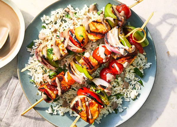 Pomegranate-tahini sauce with halloumi-and-vegetable skewers