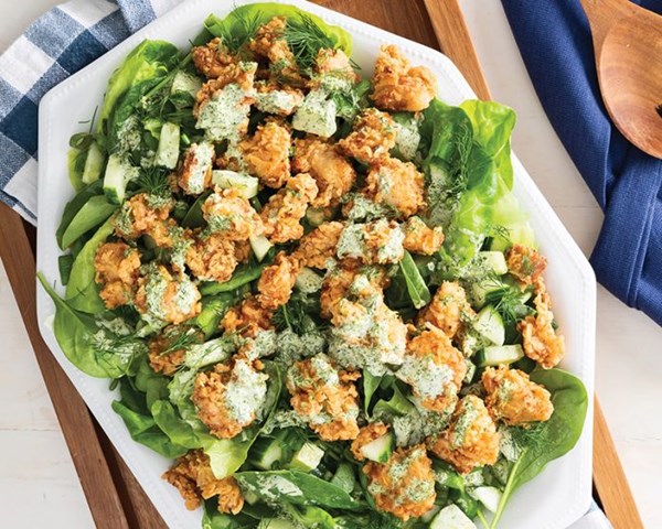 Popcorn chicken thighs with green salad