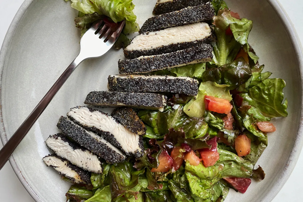 Poppy-crusted chicken & soft lettuces with plum vinaigrette