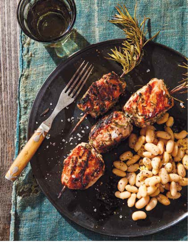 Porchetta-style pork kebabs with white beans