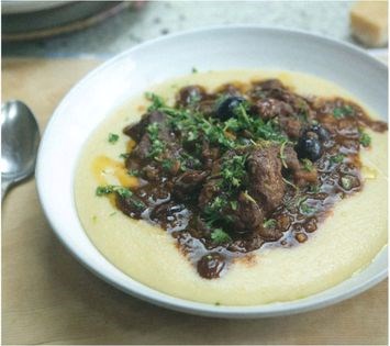 Pork, anchovy and black olive stew on polenta