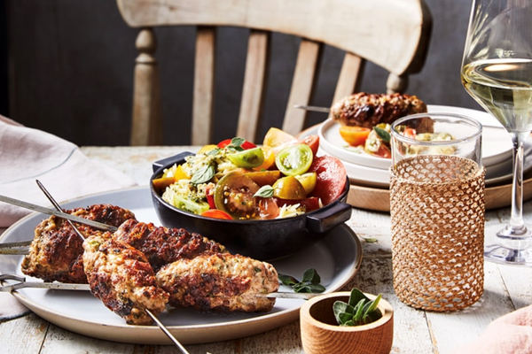 Pork and feta koftas with tomato and pesto risoni