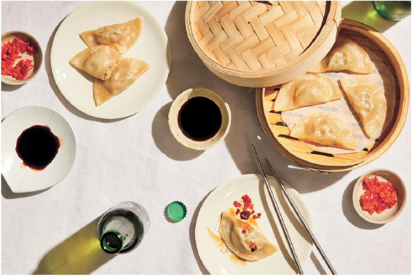 Pork and garlic chive dumplings with mandarin, chilli and soy