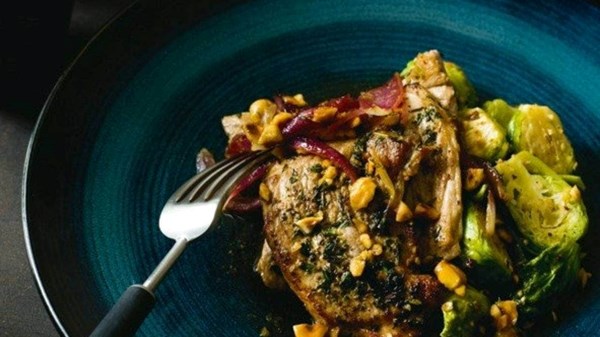Pork and hazelnuts with buttered Brussels sprouts and sherry vinegar