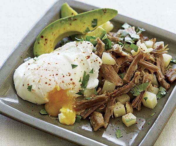 Pork and potato hash with poached eggs and avocados