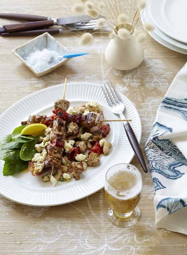 Pork and red capsicum skewers with crushed white beans and feta