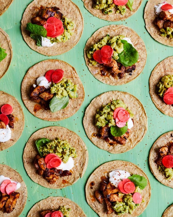 Pork belly tacos with broad bean ‘guac’ and pickled radishes