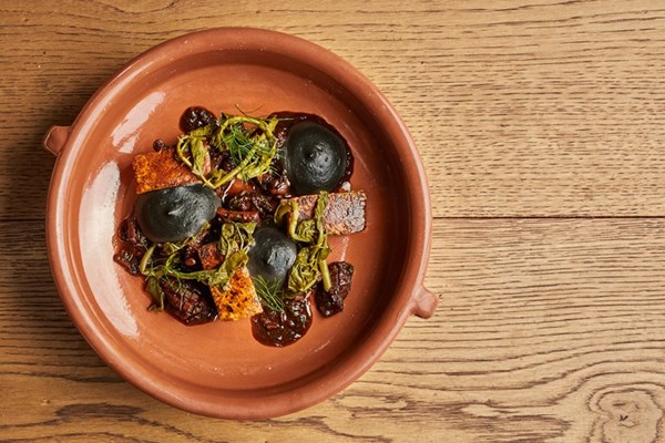 Pork belly with squid 'krassado' and squid ink mash