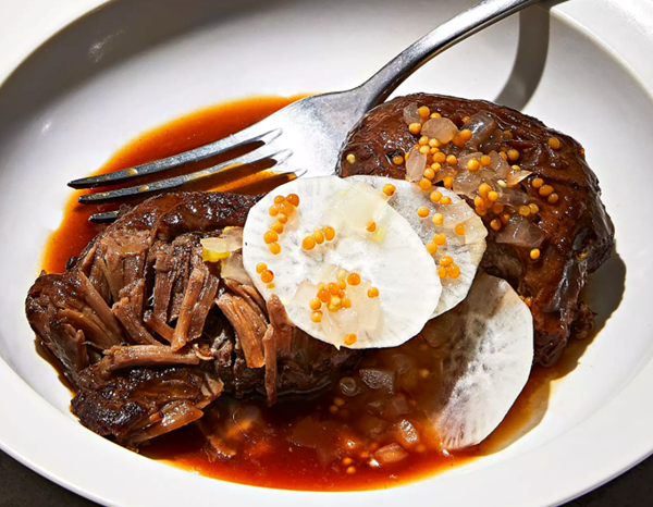 Pork cheeks with pickled onions, mustard seeds, and daikon