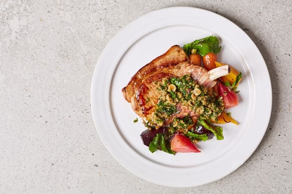 Pork chop with salt-baked beetroot, carrots and hazelnut picada