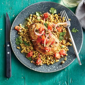 Pork chops and couscous with tomato-caper sauce
