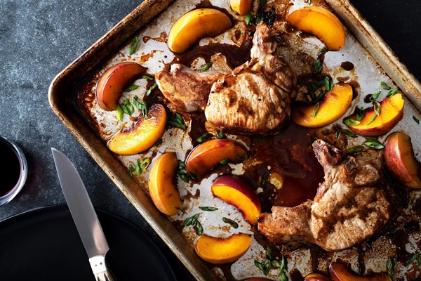Pork chops and peaches sheet-pan dinner