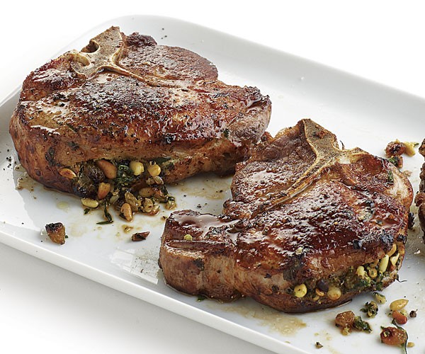 Pork chops stuffed with pine nuts and herbs