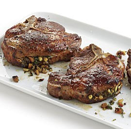 Pork chops stuffed with pine nuts and herbs