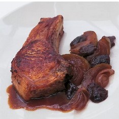 Pork chops with a confit of prunes, apples and shallots
