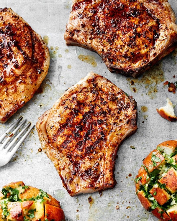 Pork chops with caraway seed rub and pull-apart bread rolls