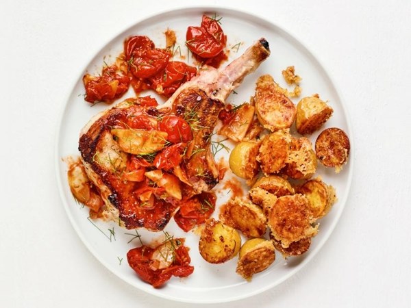 Pork chops with cherry tomatoes and cheesy baby potatoes 
