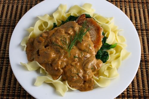 Pork chops with mushrooms, dill, and sour cream sauce