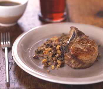 Pork chops with pecan corn bread dressing and cider gravy