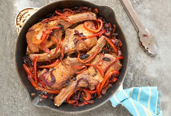 Pork chops with peppers, vinegar, and black olives