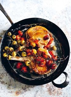 Pork chops with roasted cherry tomatoes and pickled green tomatoes