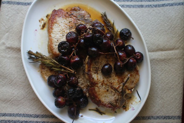 Pork chops with rosemary roasted grapes
