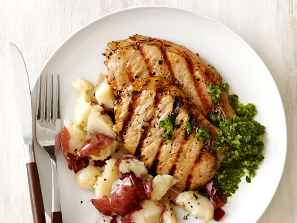 Pork chops with smashed potatoes and chimichurri sauce