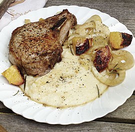 Pork chops with sugar-roasted peaches, fennel, and cheddar grits
