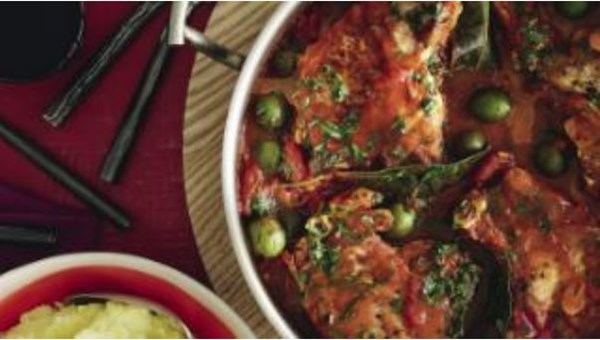 Pork chops with tomato and green olive sauce