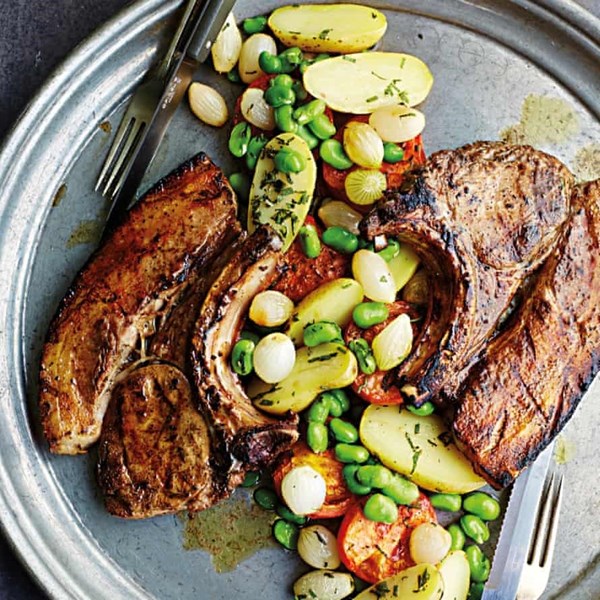 Pork chops with tomatoes, sage and broad beans