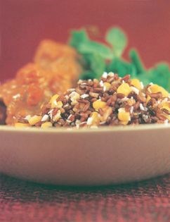 Pork dumplings with a rich coconut sauce on sweetcorn rice