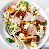 Pork fillet with carrot, cauliflower and cumin salad 