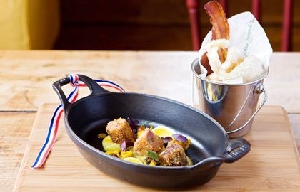 Pork fritters with pub piccalilli, apple sauce and soft poached quail's eggs