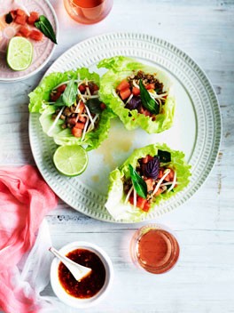 Pork in lettuce cups with watermelon and bean sprouts
