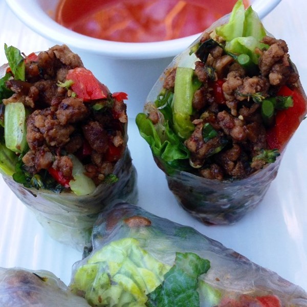 Pork, mushroom and broccolini rice paper rolls with  a sweet chilli lime dipping sauce.