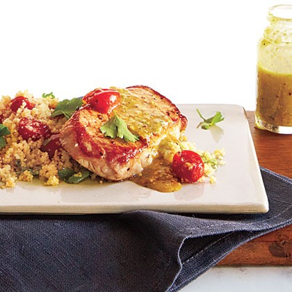 Pork over couscous with pistachio-lemon vinaigrette