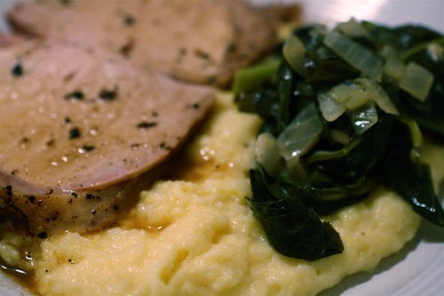 Pork rib roast with creamy polenta and braised collard greens