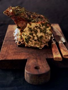 Pork rib roast with warm, buttery gremolata and roasted garlic