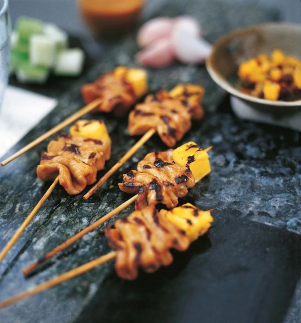 Pork satays with pineapple and spicy peanut sauce
