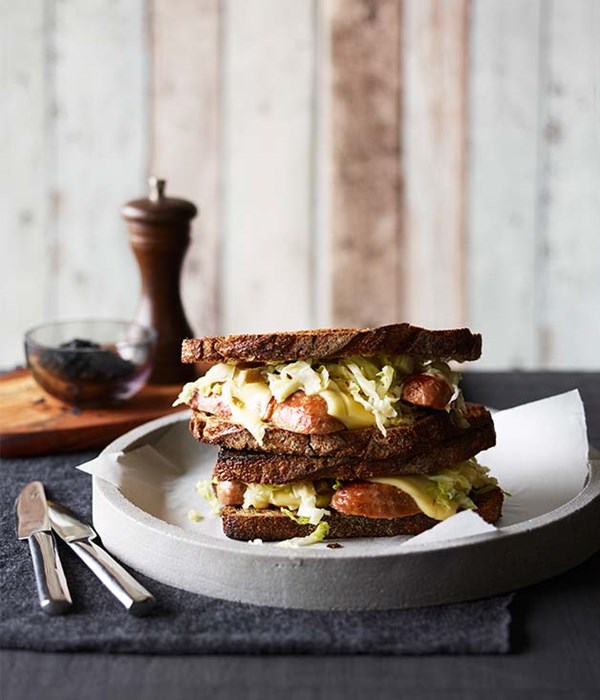 Pork sausage and Swiss cheese on toasted rye with sauerkraut