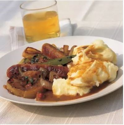 Pork sausages braised in cider with apples and juniper