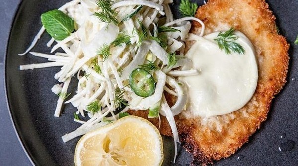 Pork schnitzel with buffalo mozzarella, and fennel, apple and sour cream slaw