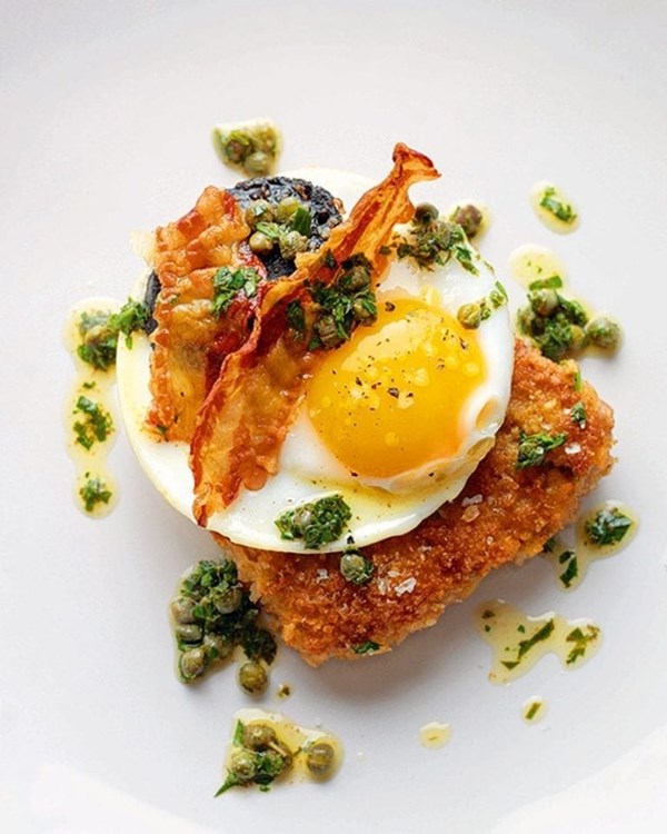 Pork schnitzel with 'executive' fried duck eggs