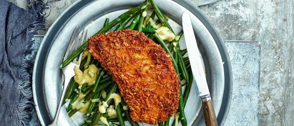 Pork schnitzel with warm lemon and caper beans