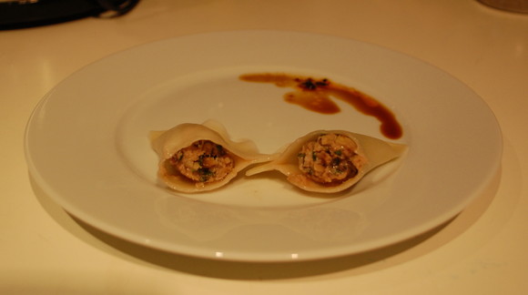 Pork, shiitake, and swiss chard dumplings with dad's awesome hot sauce
