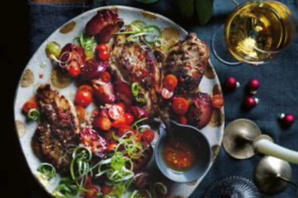 Pork steaks with grilled plums and tomato