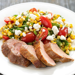 Pork tenderloin with corn, tomato, and goat cheese salad